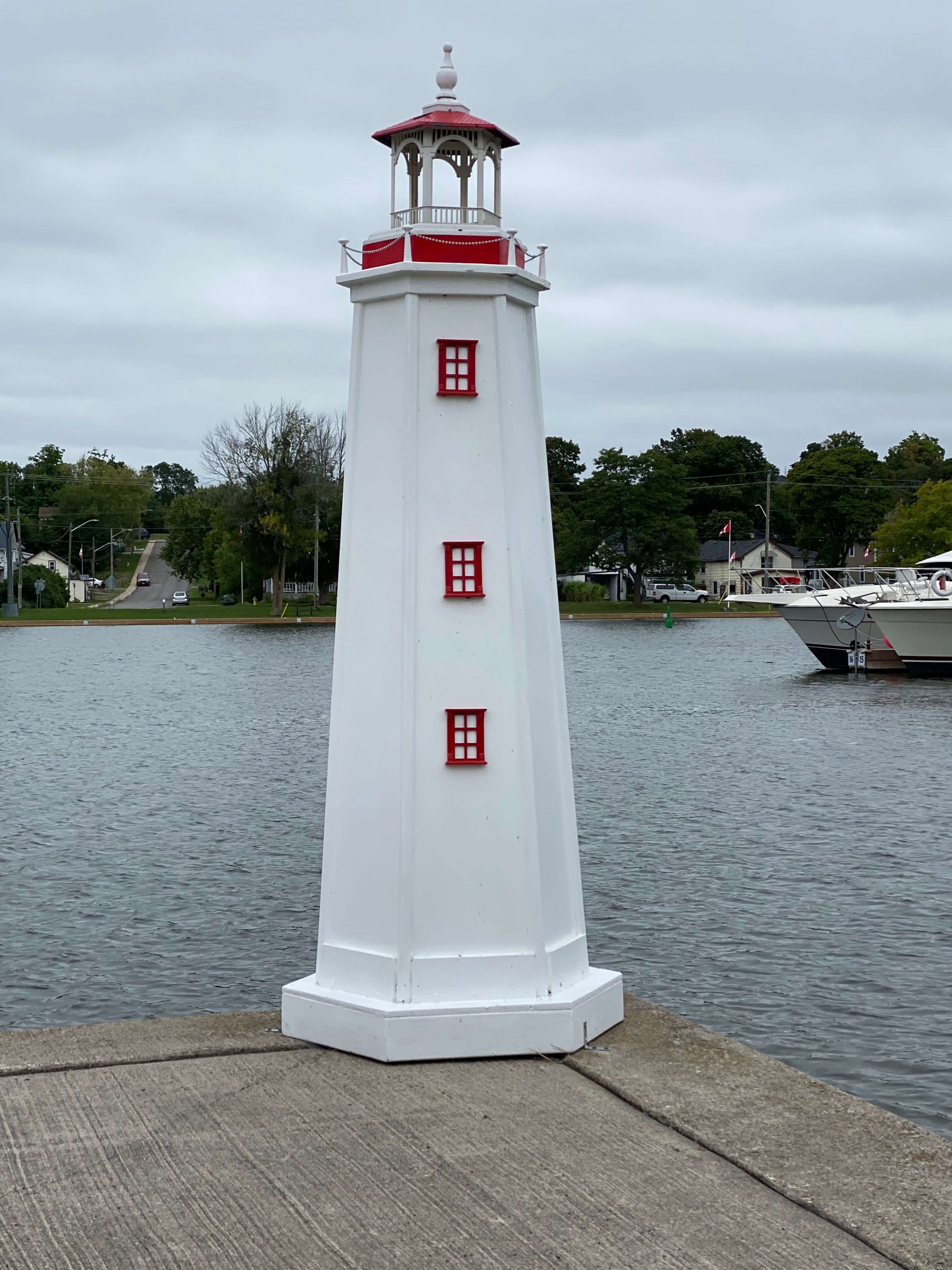 Hastings Marina's lighthouse on the Trent River is a ornament put in place for people, it is white with red window trim and is a minature lighthouse